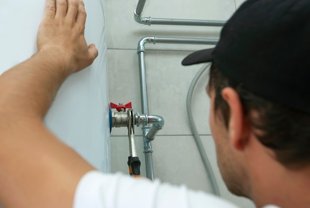 plumber screwing nut pipe heating system boiler room 244784 1613